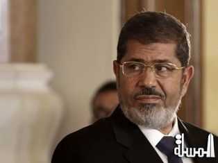 قيادي إخواني : فريق محامين دولي يصل مصر لحضور محاكمة مرسي