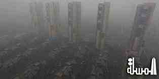 بكين تلزم سكان العاصمة البقاء فى منازلهم بسبب ارتفاع موجة الضباب الدخانى